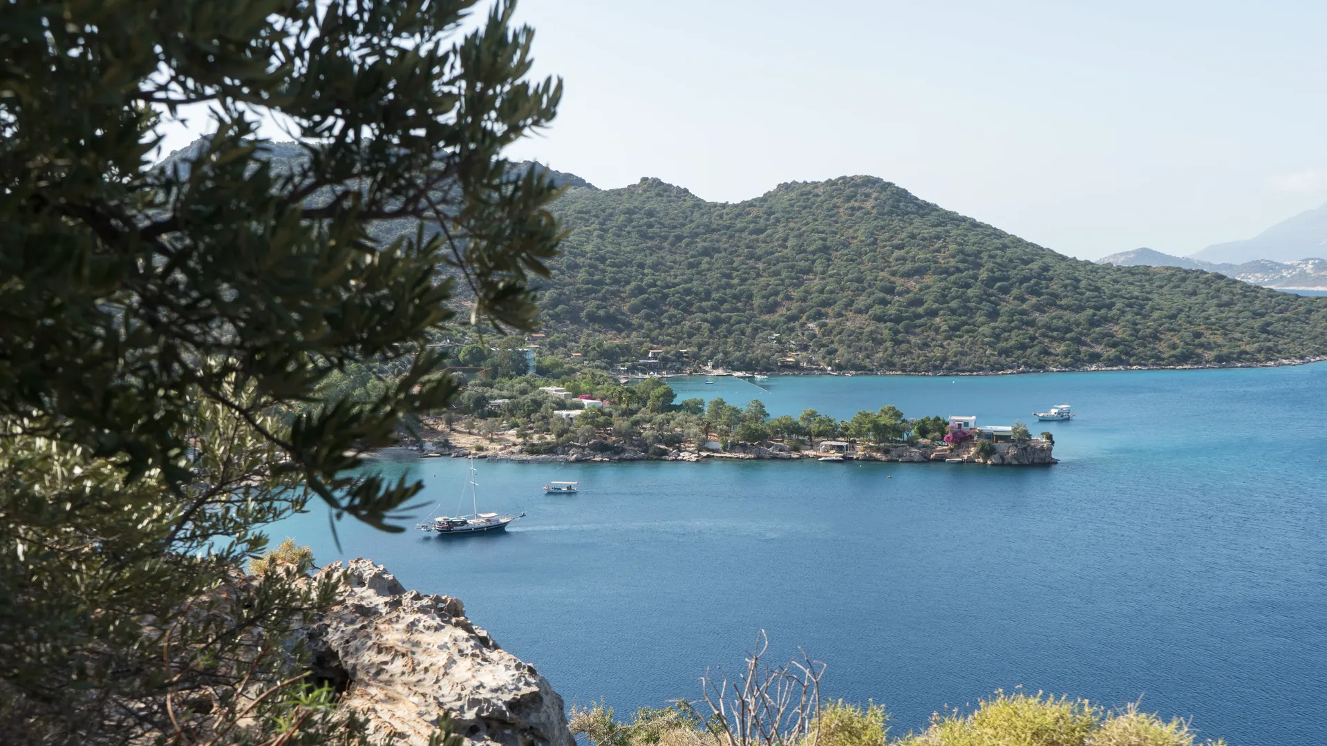 Panoramic view of the Lycian Way trail winding between mountain villages and the turquoise Mediterranean coast near Kas, Turkey